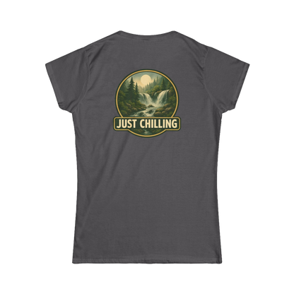 A gray t-shirt with a graphic design on the back, depicting a waterfall surrounded by trees and mountains. The text "JUST CHILLING" is displayed above the image.