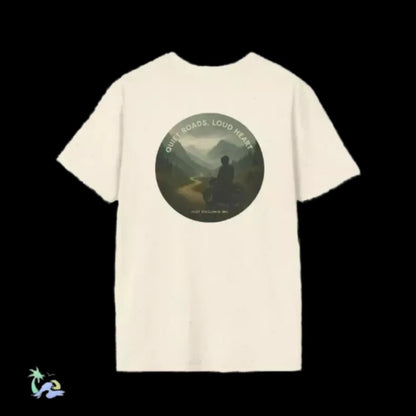 A white t-shirt with a circular graphic design on the back, depicting a person sitting in a contemplative pose in front of a scenic mountain landscape.