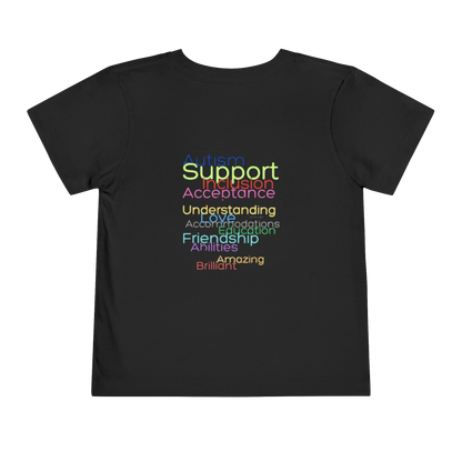The image is a black t-shirt with text printed on it in rainbow colors.