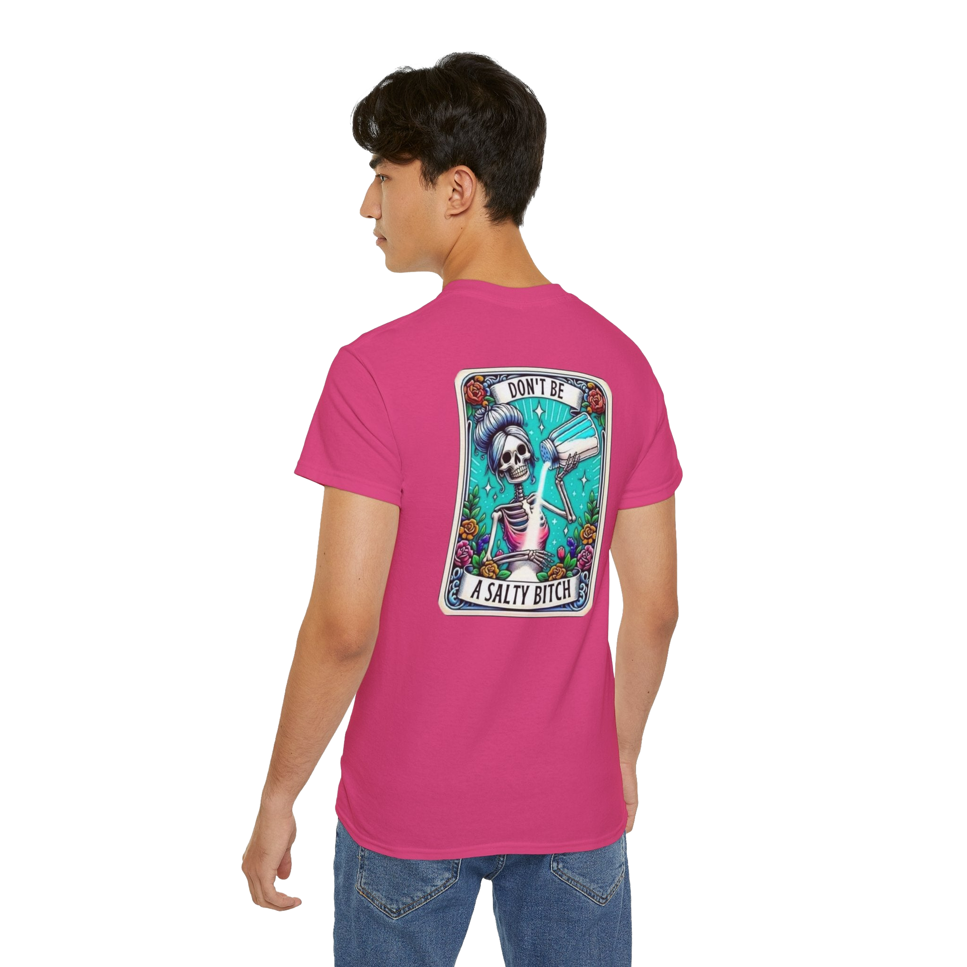 A person wearing a pink t-shirt with a graphic design on the back.