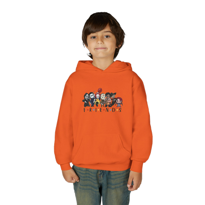 A young boy wearing an orange hoodie with a graphic of cartoon characters on it.