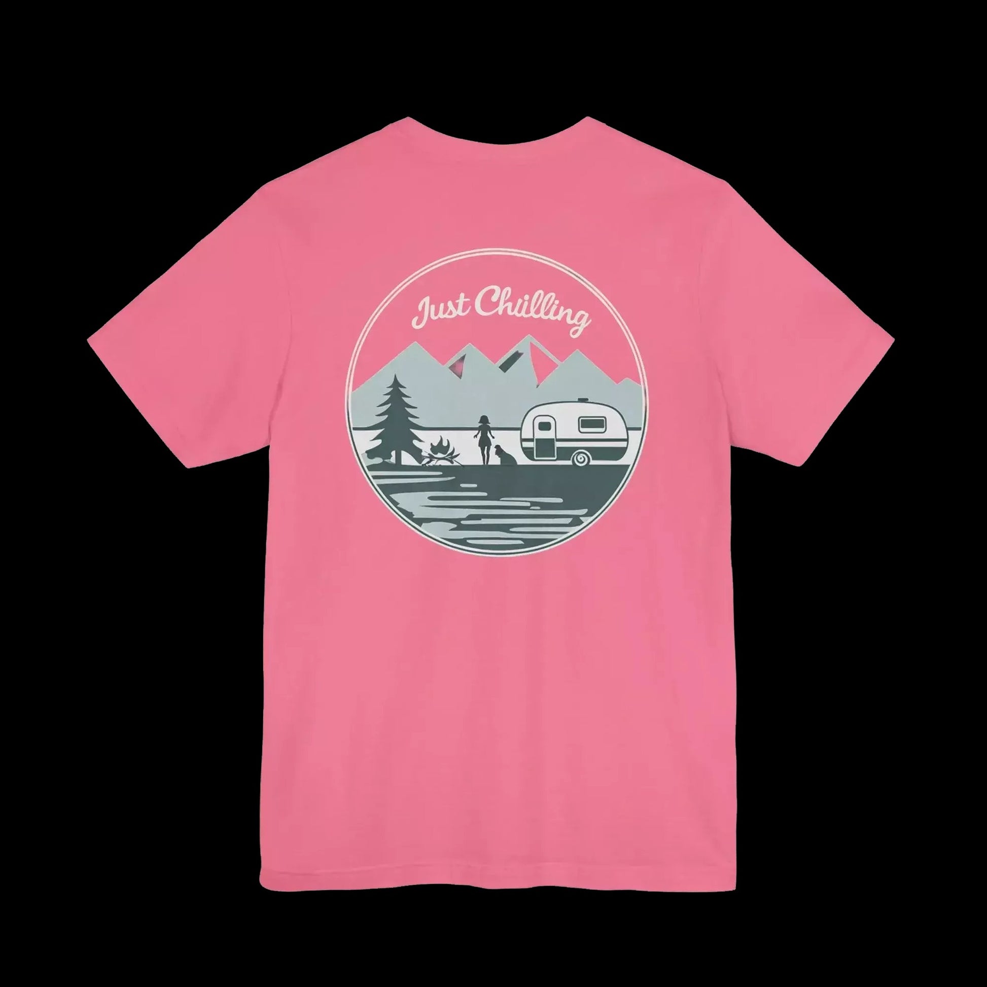 A pink t-shirt with a graphic design featuring a mountain landscape, a camper van, and the text "Just Challenging" in the center.