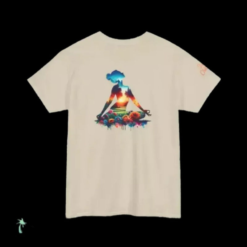 A white t-shirt with a colorful graphic design depicting a person sitting in a meditative pose surrounded by a vibrant, abstract landscape.