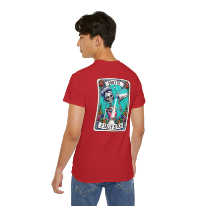 A person wearing a red t-shirt with a graphic design on the back.