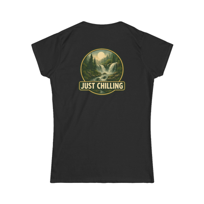 A black t-shirt with a graphic design on the back, depicting a waterfall surrounded by trees and mountains. The text "JUST CHILLING" is displayed above the image.