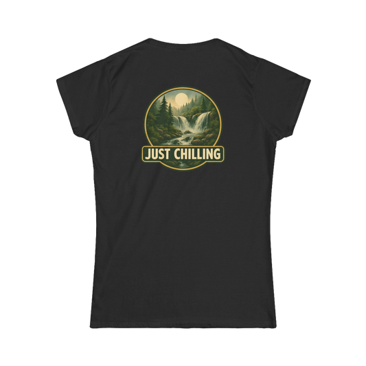 A black t-shirt with a graphic design on the back, depicting a waterfall surrounded by trees and mountains. The text "JUST CHILLING" is displayed above the image.