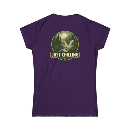 A purple t-shirt with a graphic design depicting a waterfall and forest, along with the text "JUST CHILLING" in the center.