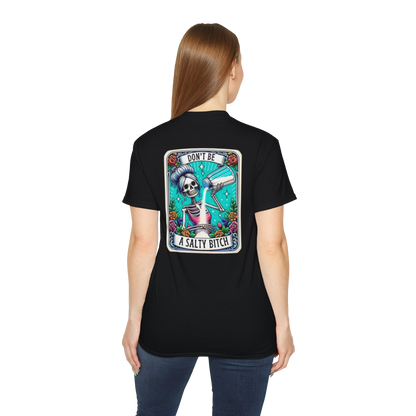 A woman wearing a black t-shirt with a graphic design on the back.