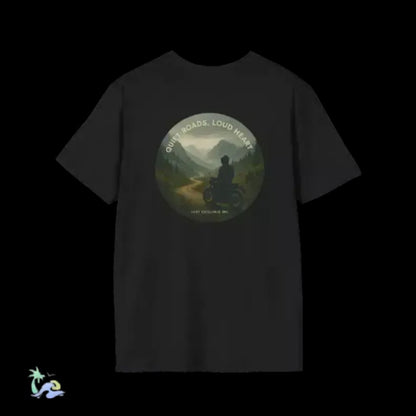A black t-shirt with a circular graphic design featuring a silhouette of a person riding a motorcycle against a scenic mountain landscape.