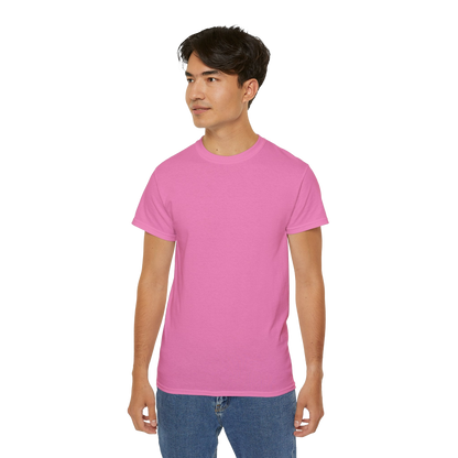 A young man wearing a pink t-shirt stands against a black background.