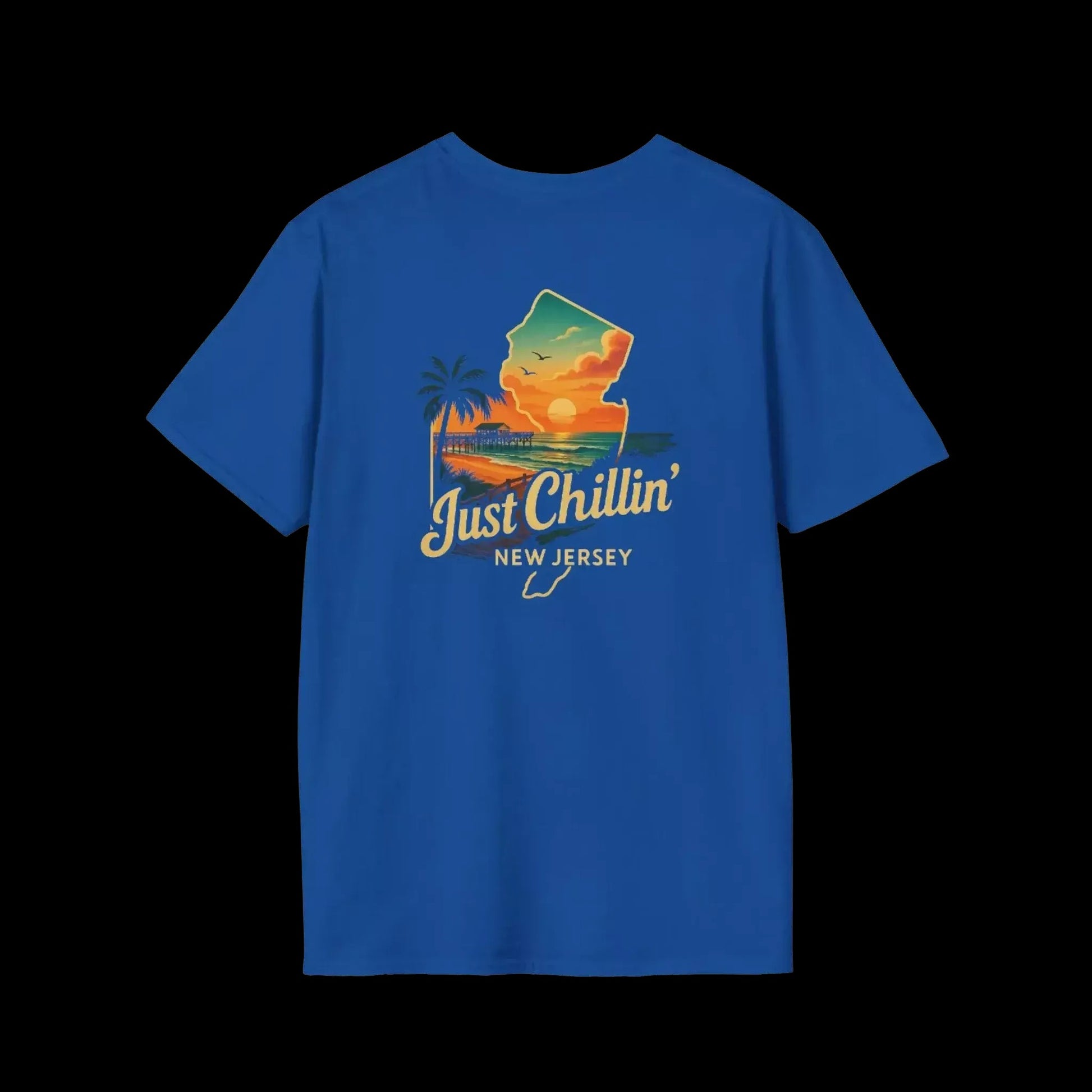 A blue t-shirt with a graphic design depicting a sunset over a beach and palm trees, along with the text "Just Chillin' NEW JERSEY".