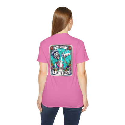 A woman wearing a pink t-shirt with a graphic design on the back.