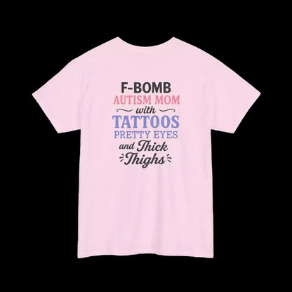 A pink t-shirt with text that reads "F-BOMB AUTISM MOM with TATToos Pretty Eyes and Thighs" printed on it.