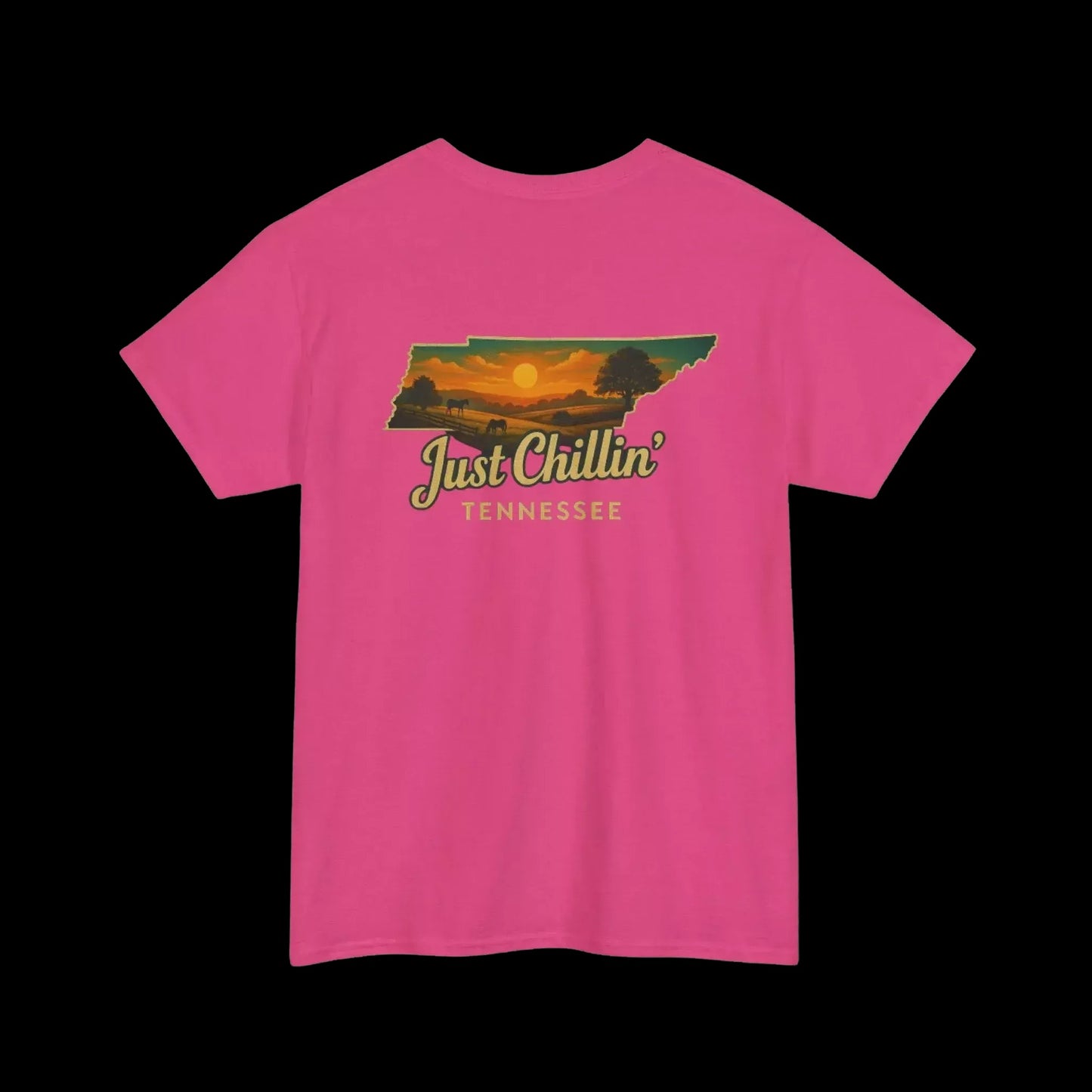 A pink t-shirt with a graphic design depicting a sunset over the state of Tennessee.
