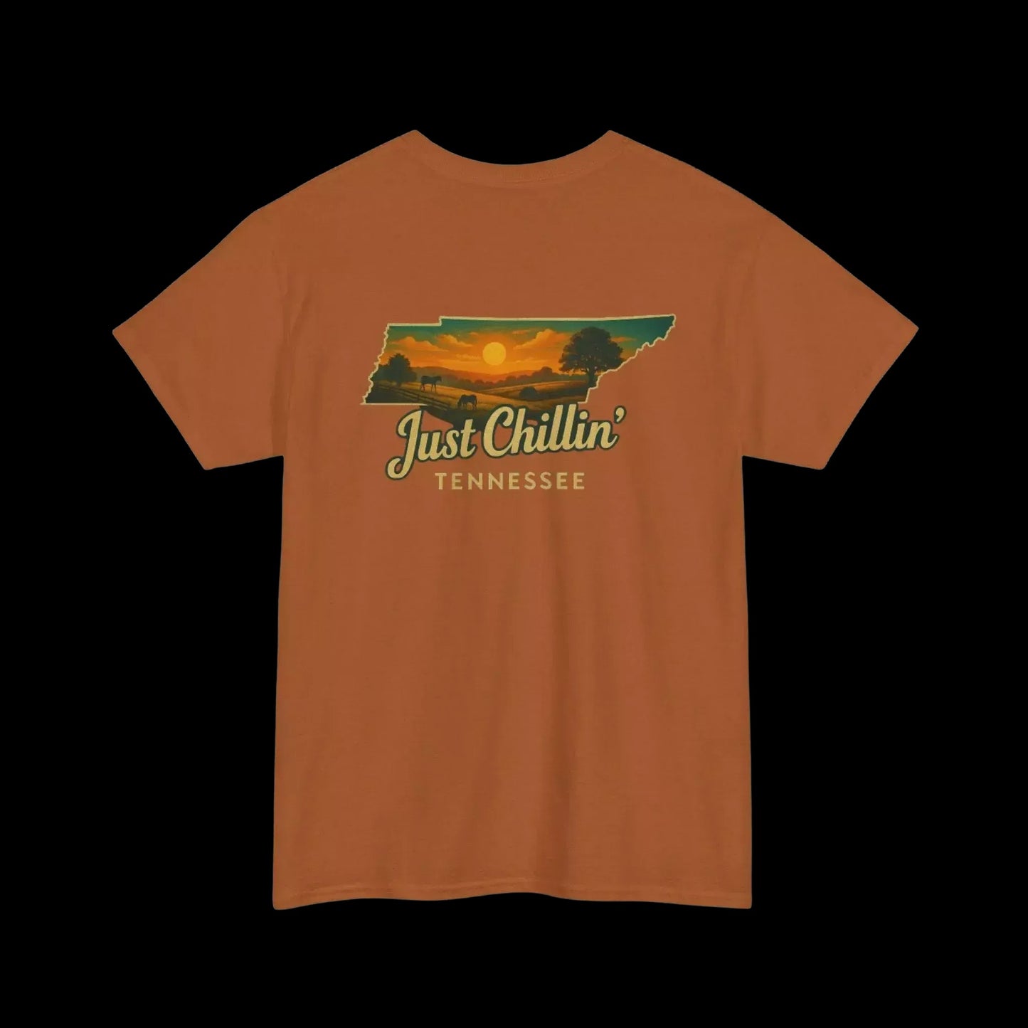 An orange t-shirt with a graphic design depicting a sunset over the state of Tennessee.