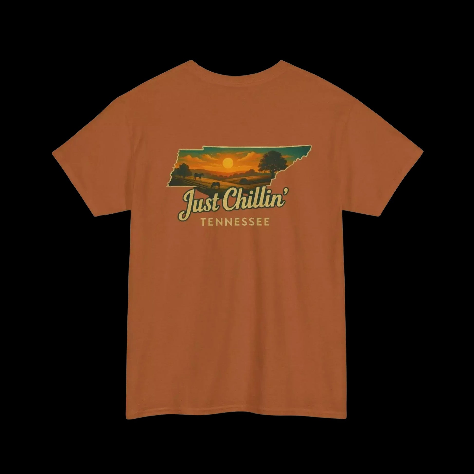 An orange t-shirt with a graphic design depicting a sunset over the state of Tennessee.