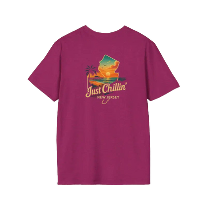 A purple t-shirt with a graphic design depicting a beach scene and the text "Just Chillin' NEW JERSEY" printed on it.