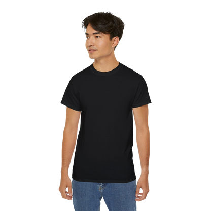 A young man wearing a black t-shirt and blue jeans stands against a black background.