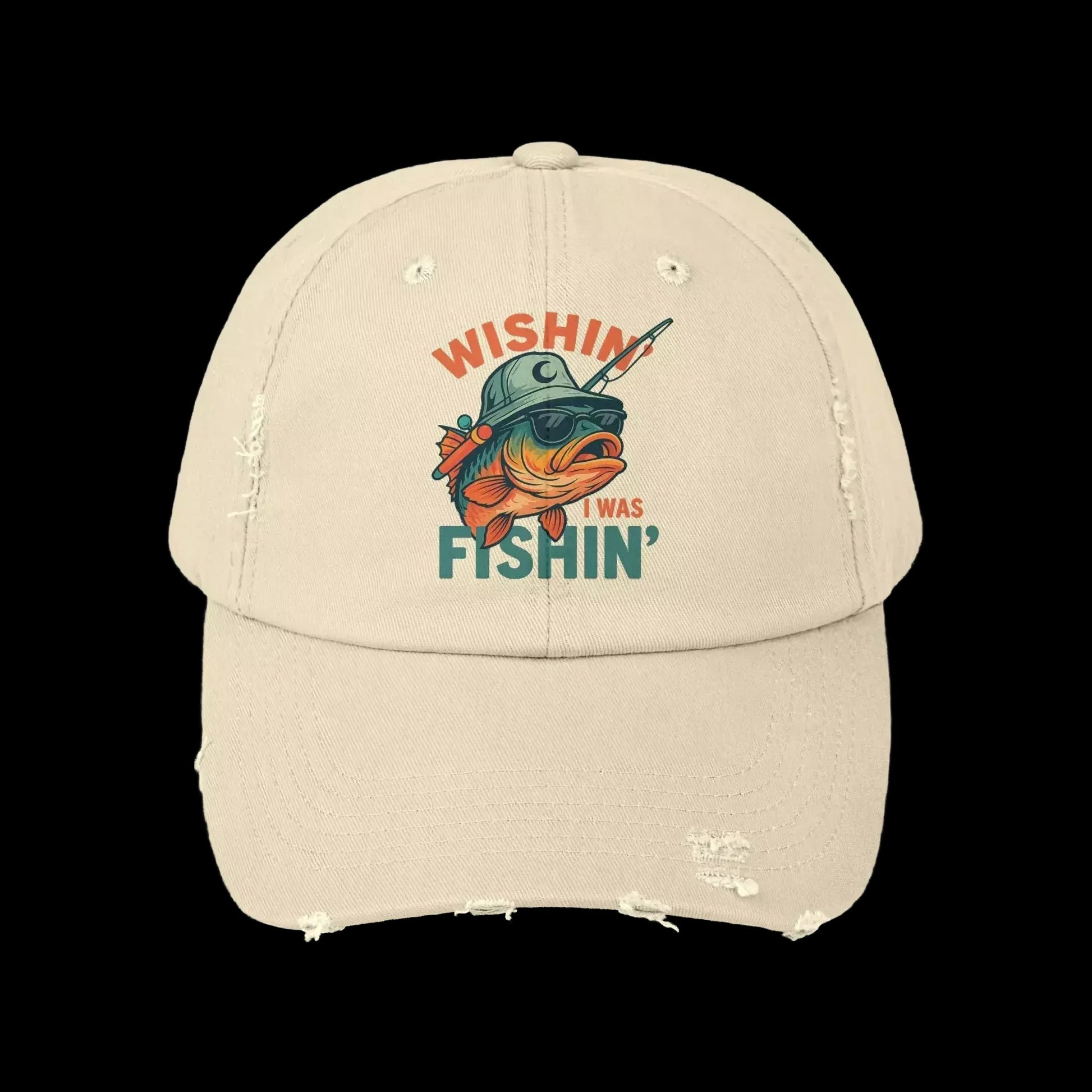 A beige baseball cap with a graphic design featuring a fish wearing a helmet and the text "Wishin' I was fishin'".