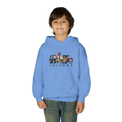A young boy wearing a blue hoodie with a graphic of cartoon characters from the TV show Friends.