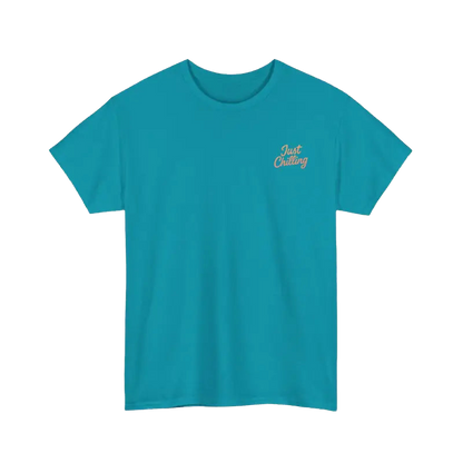 A turquoise t-shirt with the text "Just Chilling" printed on the left side.