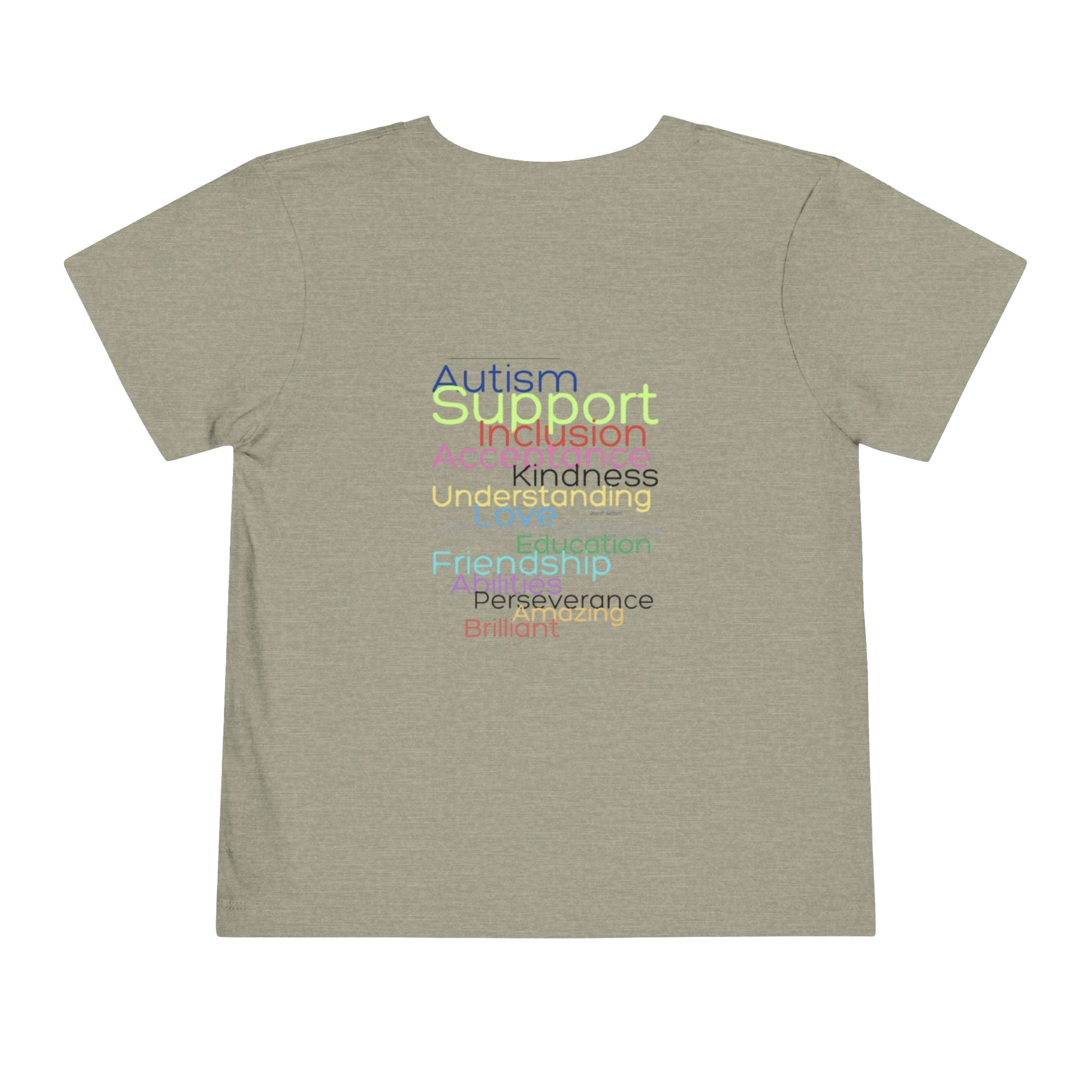 The image is a t-shirt with a graphic design featuring a list of positive traits or characteristics, such as Autism, Support, Inclusion, Kindness, Understanding, Education, Perserverance, and Friendship, all written in a colorful, stylized font.