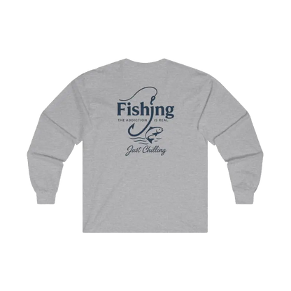 A grey long-sleeved shirt with a graphic design on the back, featuring the text "Fishing is the addiction. Just chilling."