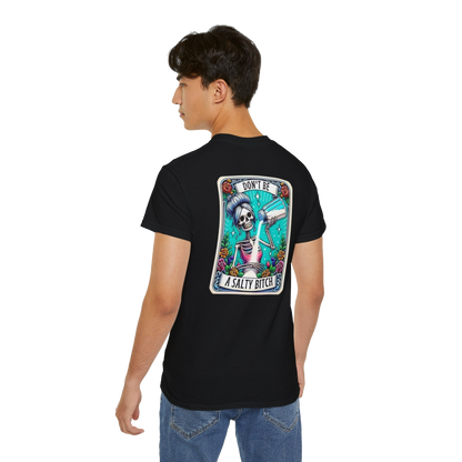 A person wearing a black t-shirt with a graphic design on the back.