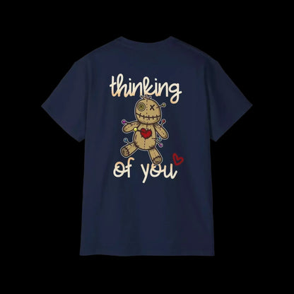 A navy blue t-shirt with a graphic design featuring a voodoo doll with a heart and the text "Thinking of you" printed on it.