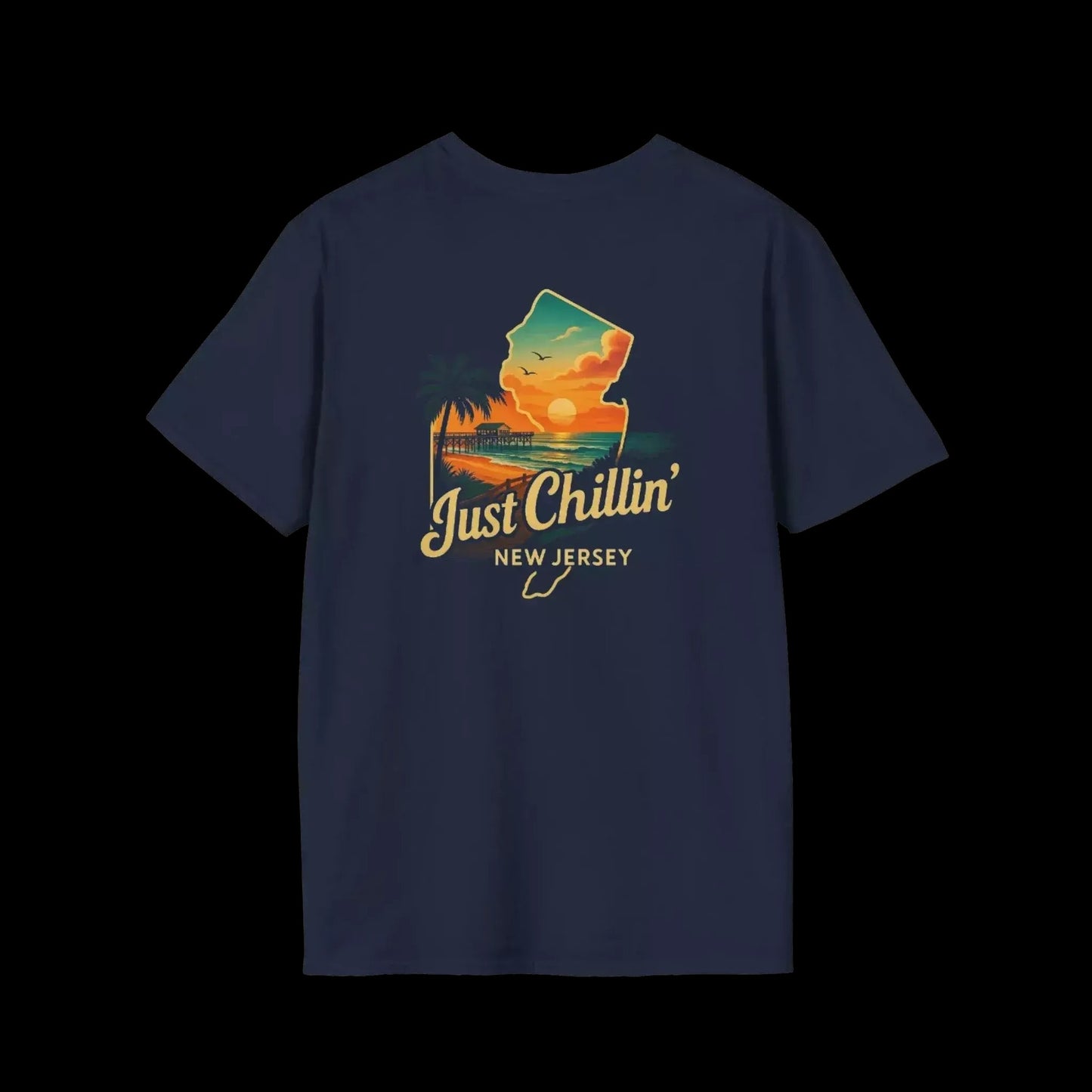 A navy blue t-shirt with a graphic design depicting a sunset over a beach and palm trees, along with the text "Just Chillin' NEW JERSEY".