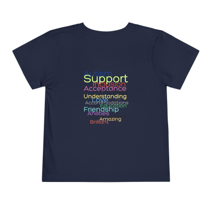 The image is a dark blue t-shirt with text printed on it. The text is in a rainbow color scheme and reads "Support Inclusion Acceptance Understanding Action Mediation Friendship Abilities Brilliance Amazing".