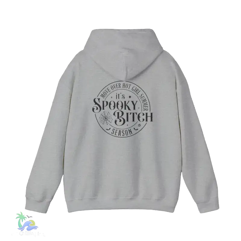 A grey hooded sweatshirt with a circular design on the back featuring the text "It's Spooky Bitch Season" printed on it.