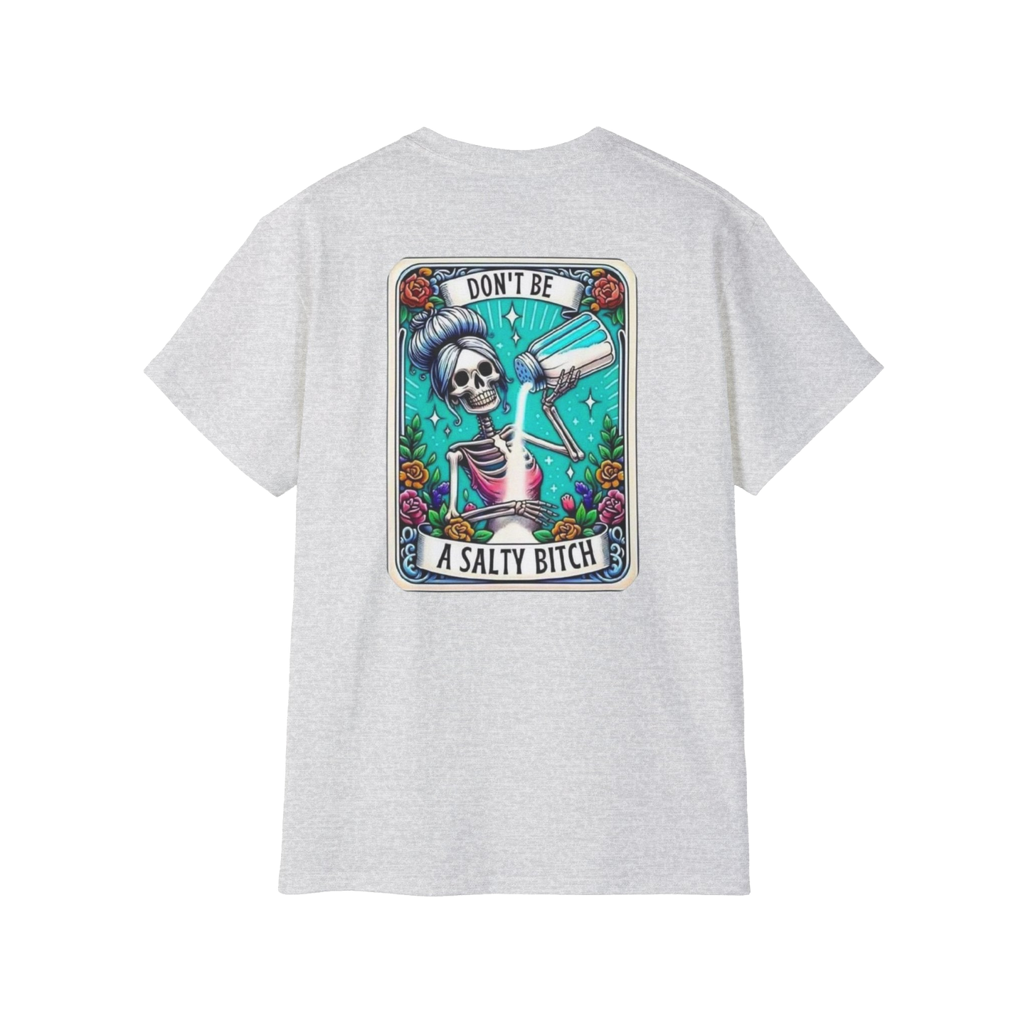 A white t-shirt with a graphic design featuring a skeleton wearing a sombrero and holding a bottle of alcohol, surrounded by colorful flowers and plants.