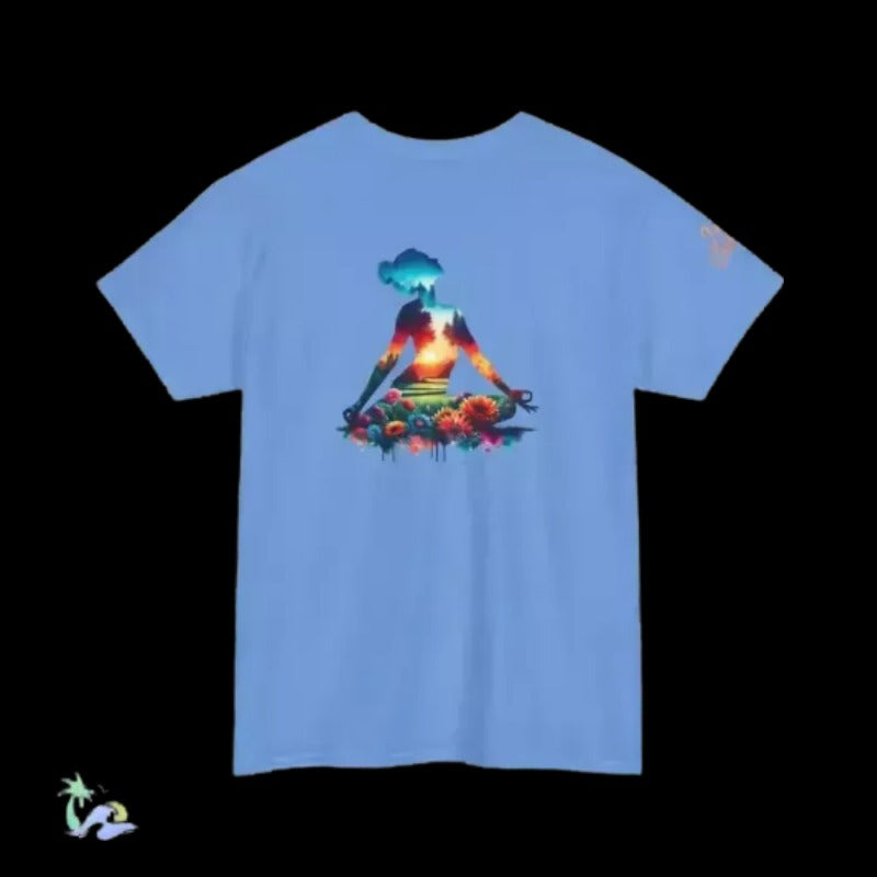 A blue t-shirt with a colorful graphic design depicting a person in a meditative pose surrounded by flowers and a sunset.