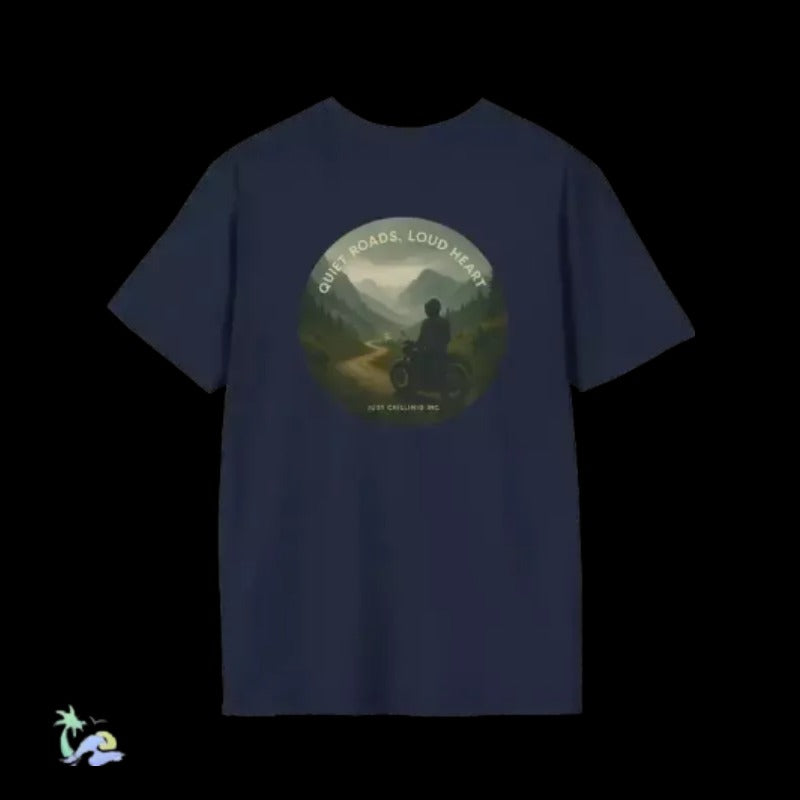 A dark blue t-shirt with a circular graphic design on the front. The design features a silhouette of a person riding a motorcycle, with mountains in the background. The text around the design reads "Quiet roads, loud heart".