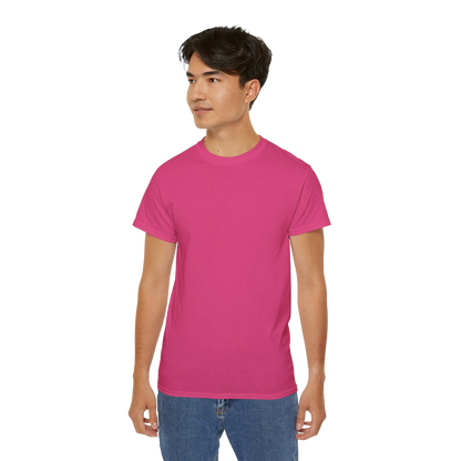 A young man wearing a pink t-shirt stands against a black background.