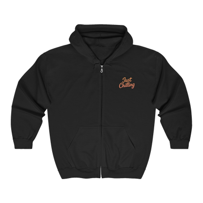 A black zip-up hoodie with the text "Just Chilling" printed on the front.