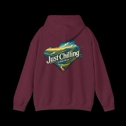 A maroon hoodie with a graphic design on the back, featuring a scenic landscape with mountains and a body of water.
