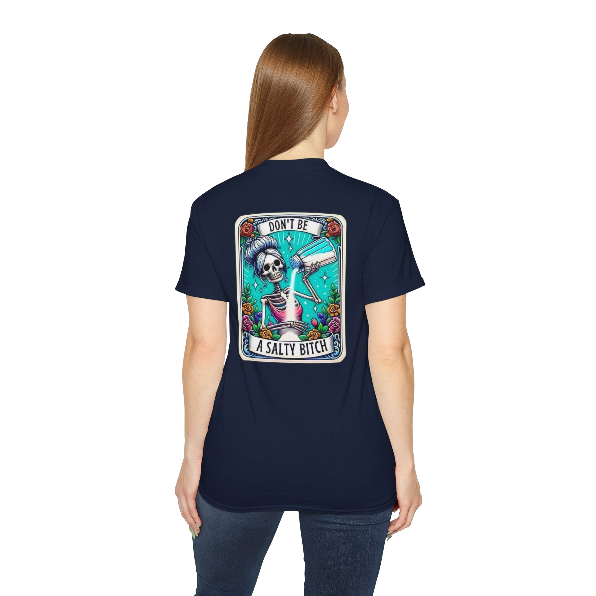 A woman wearing a navy blue t-shirt with a graphic design on the back, featuring a skeleton holding a liquor bottle and the text "Don't be a salty shit".