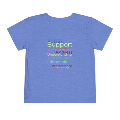 A blue t-shirt with a list of positive traits or characteristics printed on it, including Autism, Support, Kindness, Understanding, Friendship, Perserverance, and Amazing.