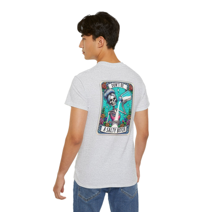 A person wearing a white t-shirt with a graphic design on the back.