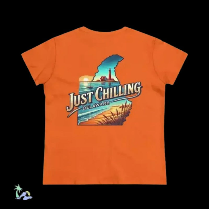 An orange t-shirt with a graphic design depicting a beach scene and the text "Just Chilling Delaware" printed on it.