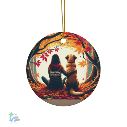 a ceramic ornament with a dog and a woman sitting in a forest