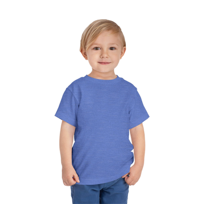 A young boy with blonde hair is smiling and wearing a blue t-shirt.