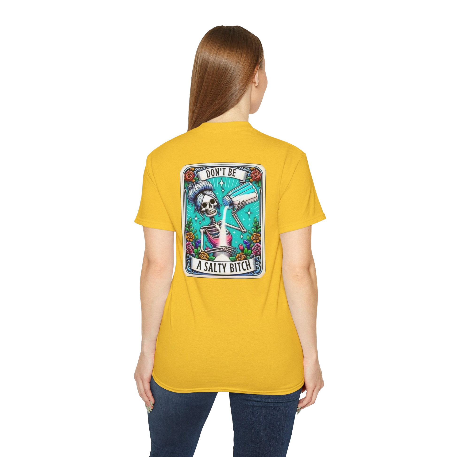 A woman wearing a yellow t-shirt with a graphic design on the back.