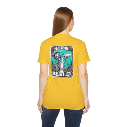A woman wearing a yellow t-shirt with a graphic design on the back.