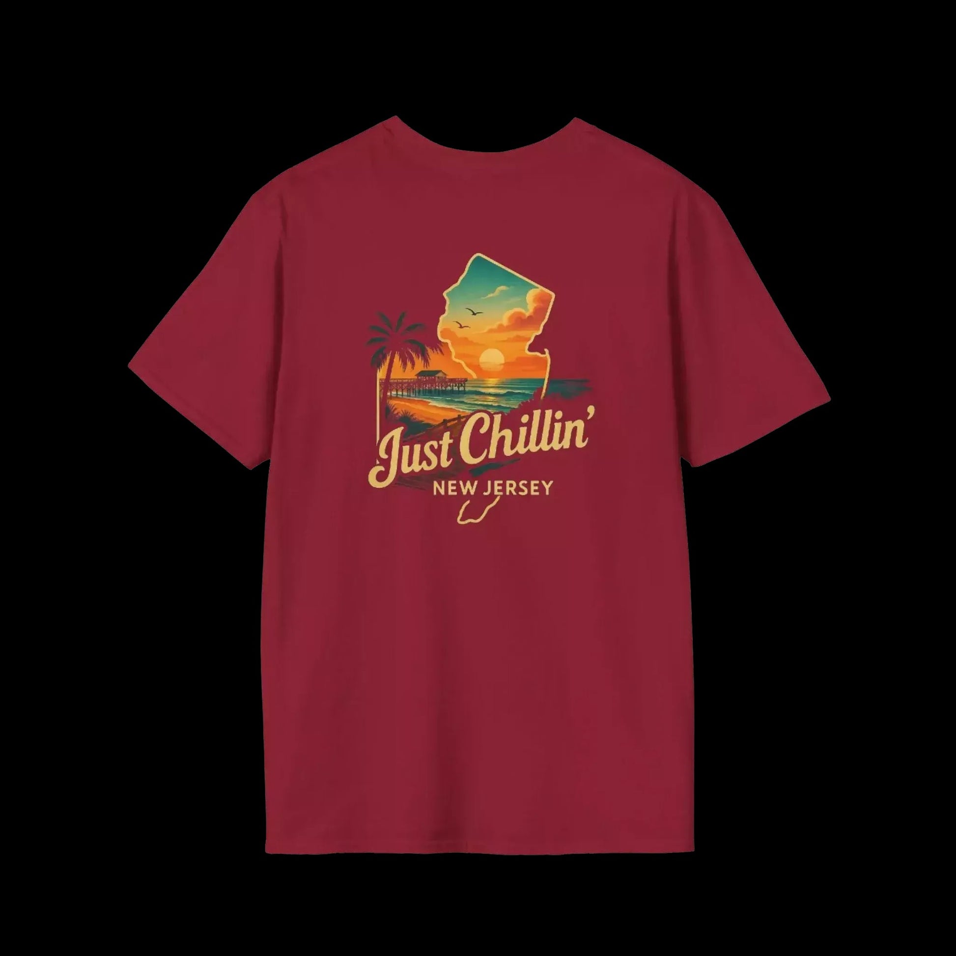 A red t-shirt with a graphic design depicting a sunset over a beach and palm trees, along with the text "Just Chillin' NEW JERSEY".