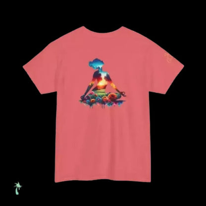 A pink t-shirt with a colorful graphic design depicting a person sitting in a meditative pose surrounded by various elements, including flowers and a bird.