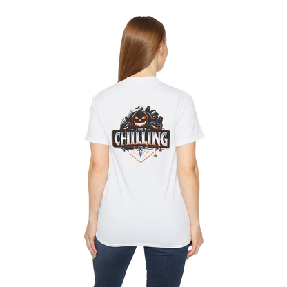A woman wearing a white t-shirt with a graphic design on the back.