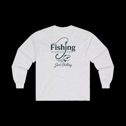 A white long-sleeved shirt with a graphic design on the back, featuring the text "Fishing is the addiction. Just chilling."